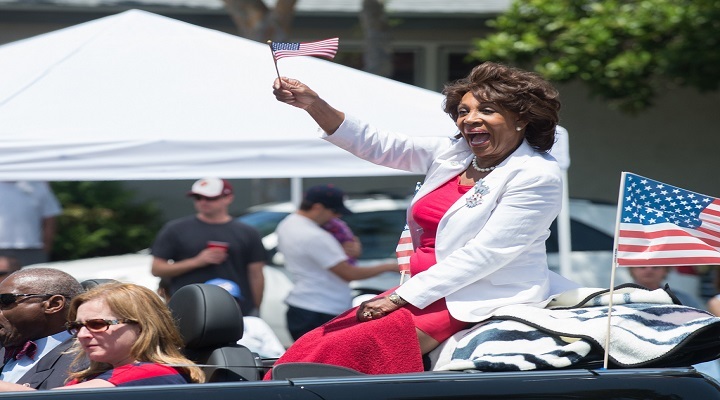 Maxine Waters supporters burn the America flag while chanting “b